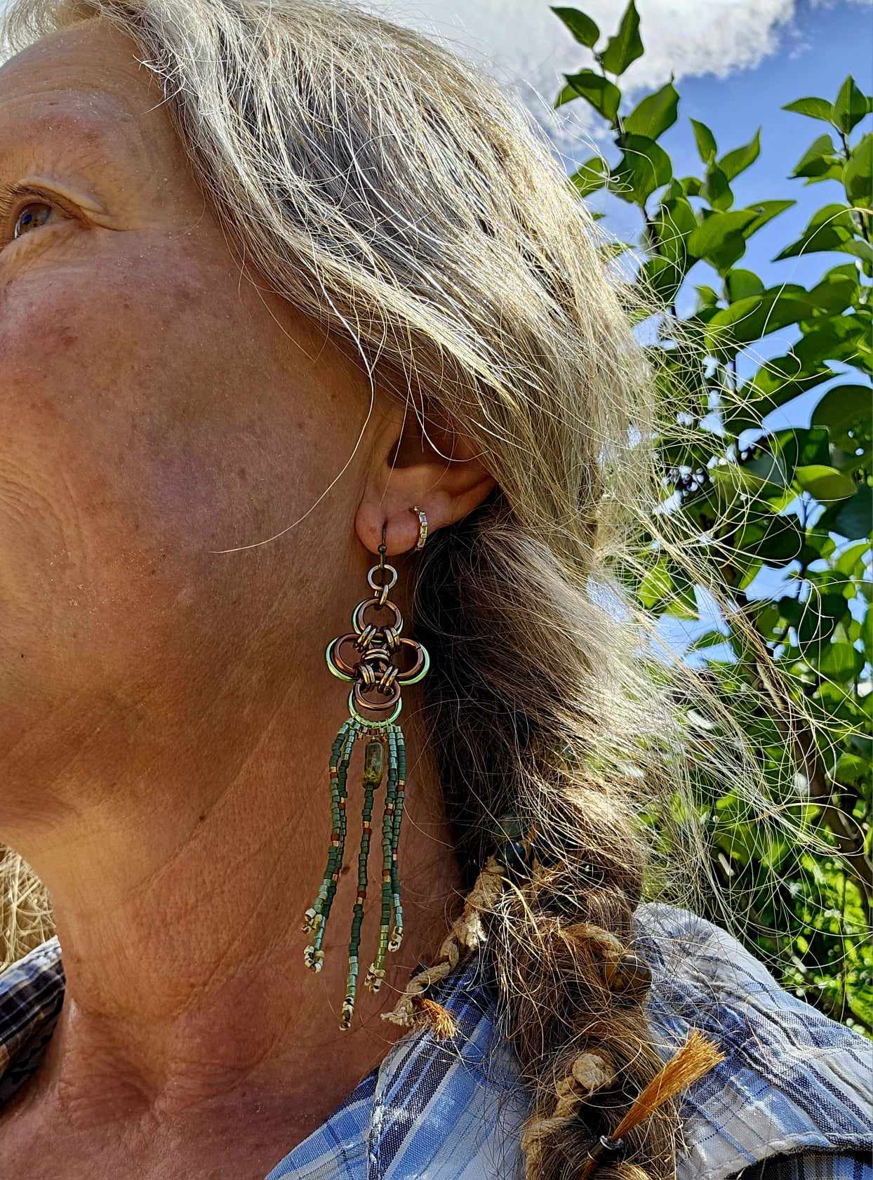 Elevate your style with our Green Japanese Cross Earrings. Handcrafted with a Japanese chainmaille design and Miyuki glass beads. Add a unique touch to your outfit.