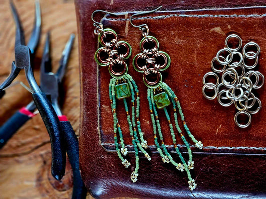 Elevate your style with our Green Japanese Cross Earrings. Handcrafted with a Japanese chainmaille design and Miyuki glass beads. Add a unique touch to your outfit.